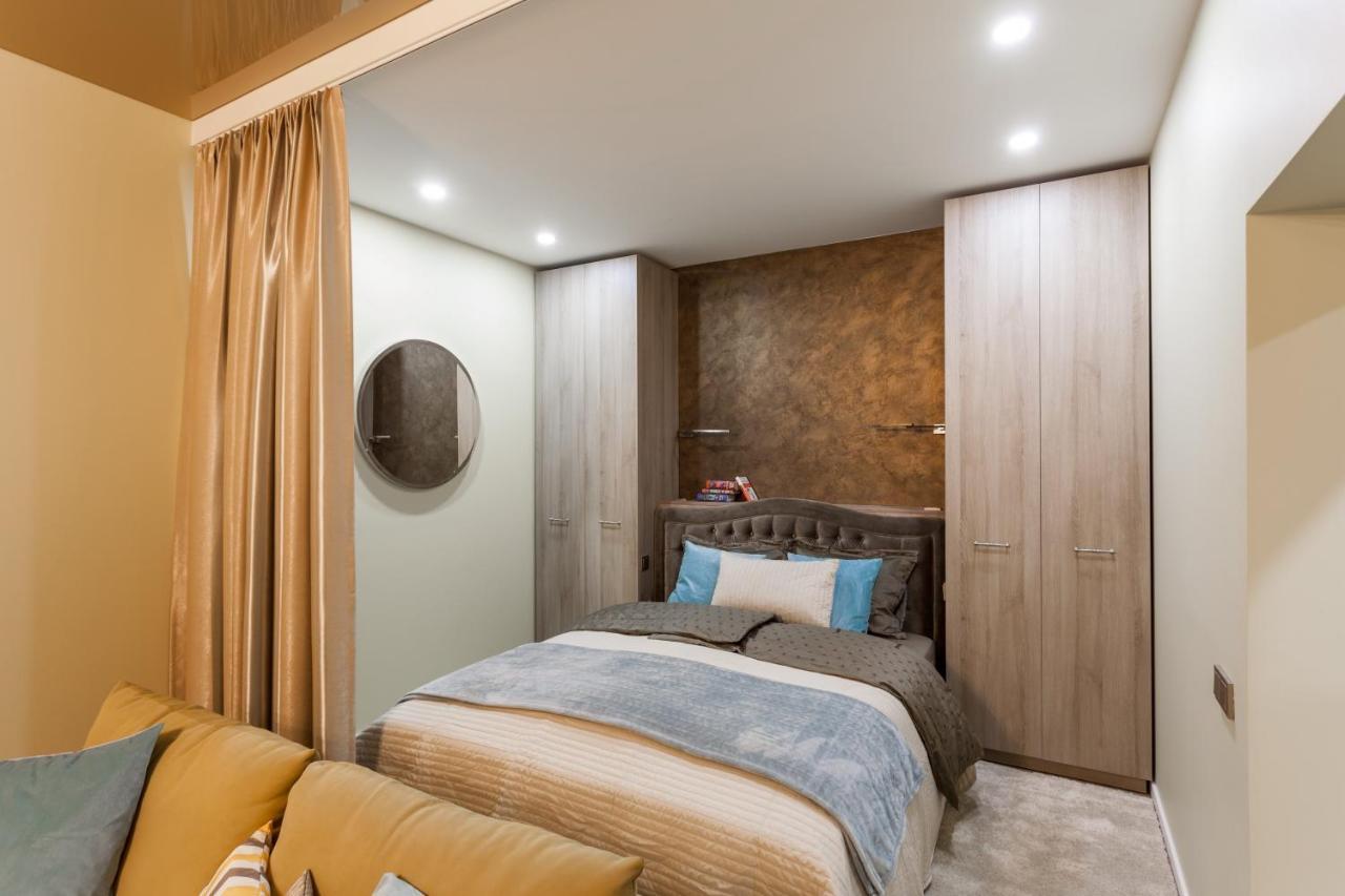 Raugyklos Apartamentai Вилнюс Стая снимка